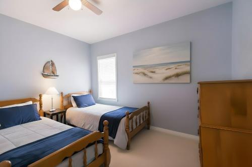 a bedroom with two beds and a window at PRAIRIE SKY GETAWAY in Cheyenne