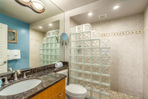 a bathroom with a toilet and a sink and a shower at Kihei Beach 606 - Direct Ocean Front, Central AC! in Kihei