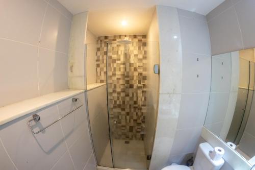 a bathroom with a shower and a toilet at Hostel Casa 8 in Rio de Janeiro