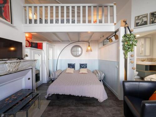 a bedroom with a bed with two pillows on it at Parenthèse en Ville in Arcachon