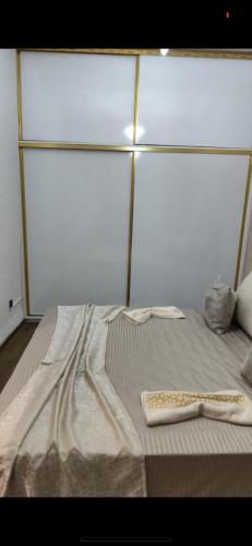 a bed in a room with a mattress sidx sidx at Le soleil de Larache in Larache