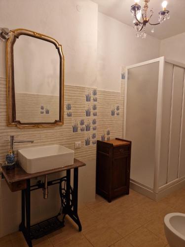 a bathroom with a sink and a mirror at La terrazza del Conte in Siena