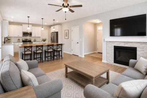 a living room with a couch and a fireplace at Alpine Haven Getaway in Vail