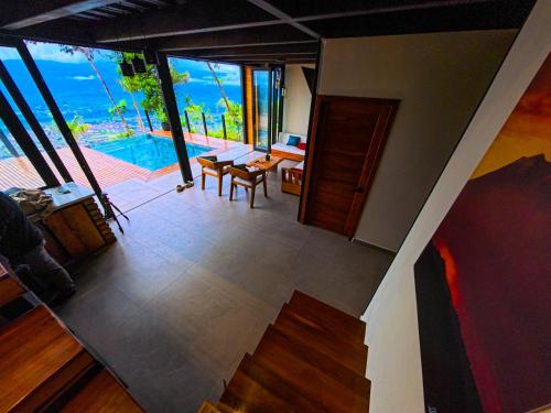 an overhead view of a living room with a view of the ocean at Kilamo sky glamping macas in Macas