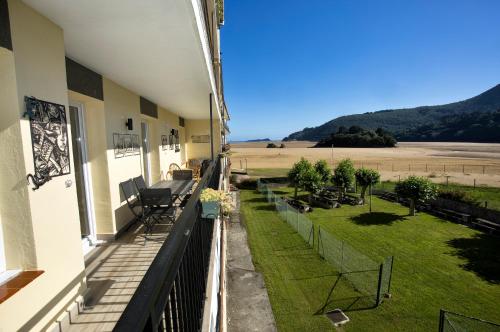 a balcony of a house with a view of a field at El Secreto de Sandindere in Busturia