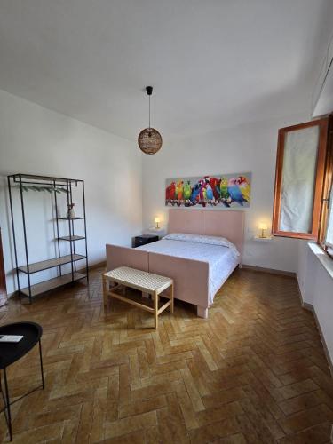 a bedroom with a bed and a table and a ladder at FasHion HOme in Ameglia