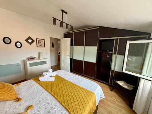 a bedroom with a teddy bear sitting on a bed at Piso La Cumbre - CEE in Cee