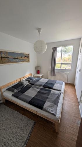 a bedroom with a large bed in a room at Sólheimar in Blönduós