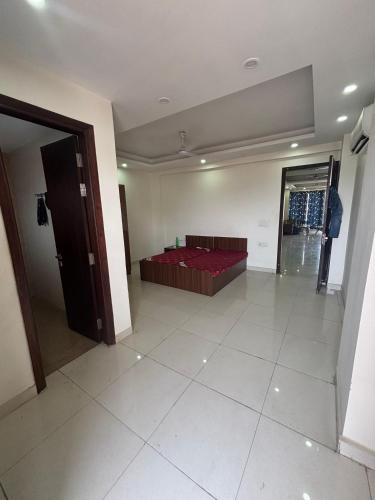 a room with a red bed in a room at Hotel New Imperial inn in Chhatikara