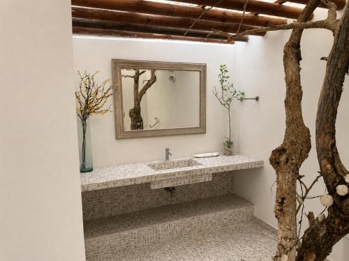 a bathroom with a sink and a mirror at Isla Risa in Cartagena de Indias