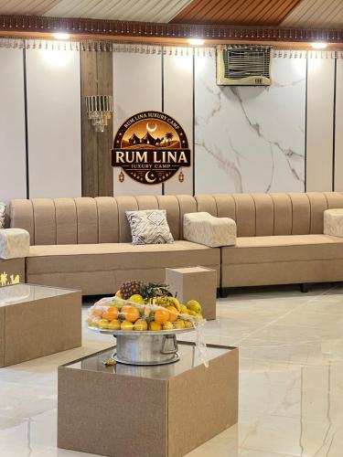a lobby with a tray of fruit on a table at RUM LlNA lUXRY CAMP in Wadi Rum