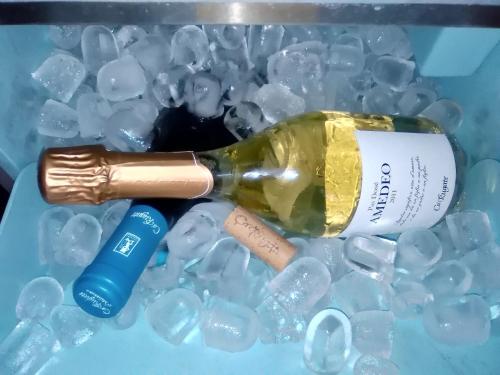 a bottle of wine in a box with crystals at Hotel Fontana Verona in Verona