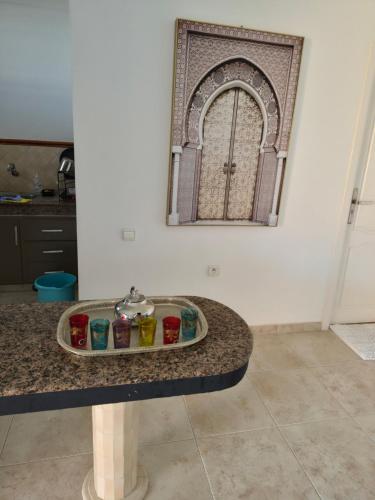a sink in a kitchen with a mirror on the wall at Rabat hassan in Rabat