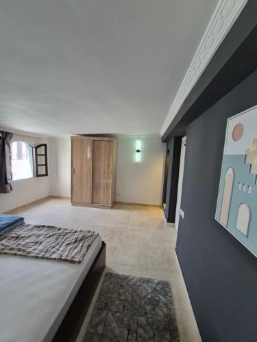 a bedroom with a large bed in a room at Rabat hassan in Rabat