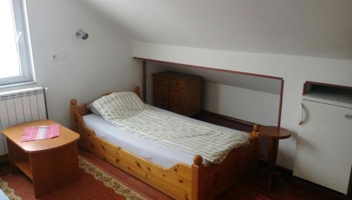 Tempat tidur dalam kamar di Guesthouse Hadžići