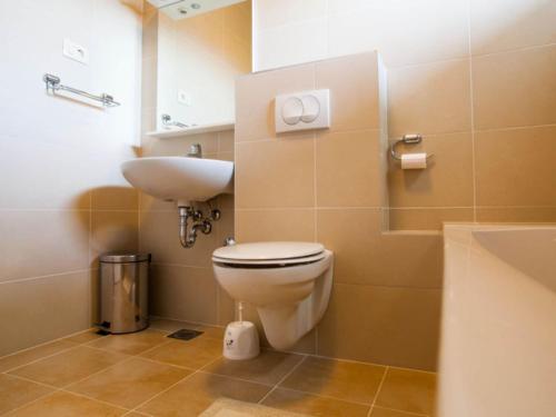 a bathroom with a toilet and a sink at Apartments Despot Zaostrog RR in Zaostrog