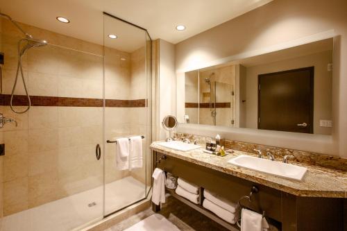 a bathroom with a sink and a shower at Twin Arrows Navajo Casino Resort in Elden Pueblo