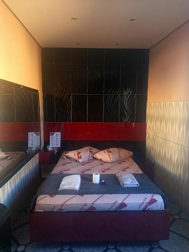 a small bedroom with a bed in a room at Hotel Santo Amaro inn in São Paulo