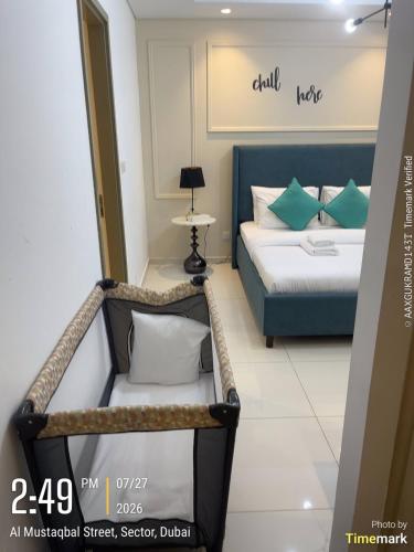a hotel room with a bed and a sign that reads call us at Arabian Prime in Dubai