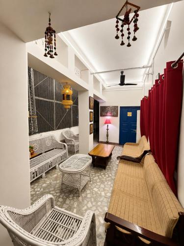 a living room with a couch and a table at Inka Kashi Hostel Varanasi in Varanasi