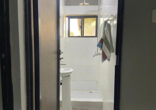 a bathroom with a toilet and a sink at Pizzaro Flats 2 in Chongwe