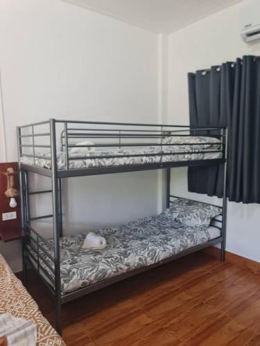 a room with two bunk beds in a room at Maya Resort Samui - Family Resort in Bophut