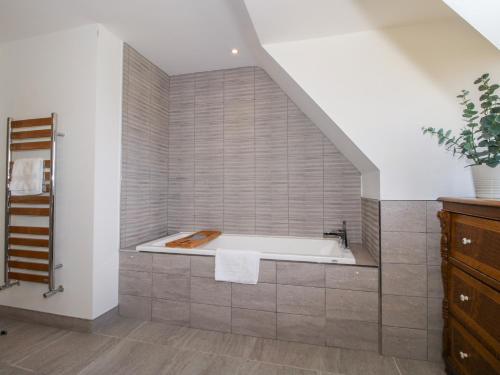 a bathroom with a bath tub and a sink at White House in Montgomery