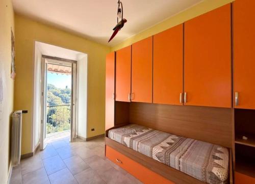 a bedroom with a bed and cabinets and a window at Alloggio turistico Brancaleone in Genazzano