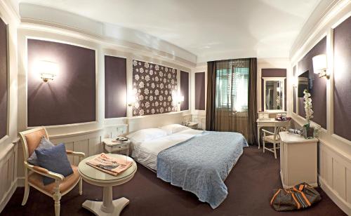 Postel nebo postele na pokoji v ubytování Europa Hotel Design Spa 1877