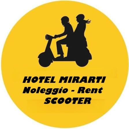 a yellow sign with a man and a woman riding a scooter at Mirarti Boutique Hotel - Witamy in Rapallo
