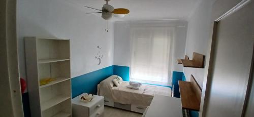 a small room with a bed and a window at Duna Hollidays in Puerto de Sagunto