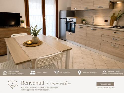 a kitchen with a table with chairs and a kitchen with a kitchen at Appartamento Magnolia 209 in Pomezia