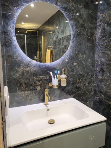 a bathroom with a sink and a mirror at Valle du mezzane in Valle-di-Mezzana