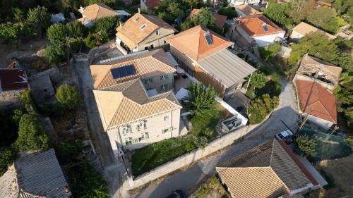 an overhead view of a large house with roofs at Dervisia Stonehouse 3 in Lazaráta
