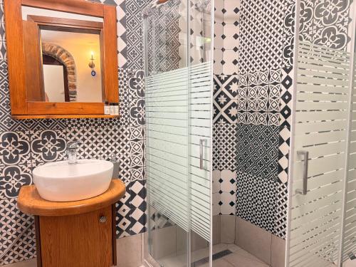 a bathroom with a sink and a mirror at Mastic Ev in Chios
