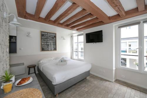 Studio parisien 20m2 en face du musee Grevin - 2P