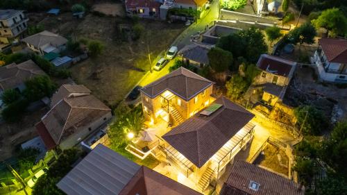an overhead view of a house with lights at Dervisia Stonehouse 4 in Lazaráta