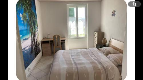 a bedroom with a bed and a desk and a window at Zenitude in Goumoens-la-Ville