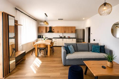 a living room with a couch and a table at Apartment Mamma in Začretje