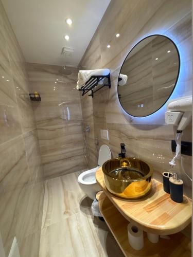 a bathroom with a sink and a toilet at Sulejmanasi Rooms in Vlorë