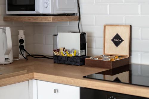 a kitchen counter with a box of kitchen utensils at NOVERA Apartments #24 in Turčianske Teplice