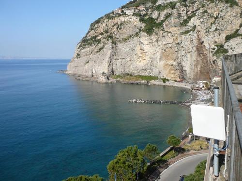 a view of a body of water next to a mountain at Villino L'Aranceto Sorrentino in Meta