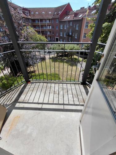 an open balcony with a view of a yard at Old appartment in Helsingborg