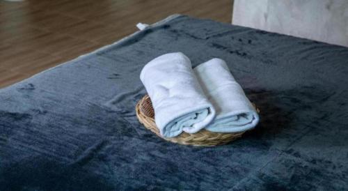 a basket with towels on top of a table at Sun Resort in Sa Kaeo