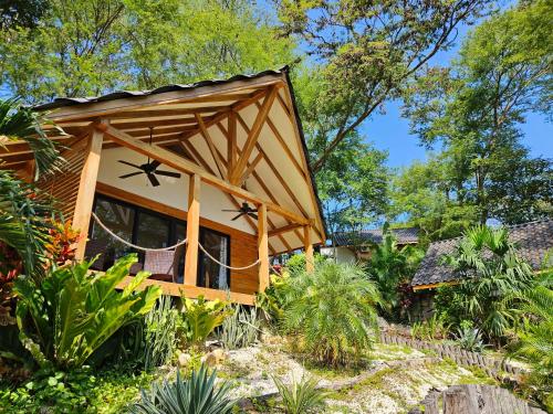 a house with a roof with stars on it at Beach resort playa Leona in Gigantes