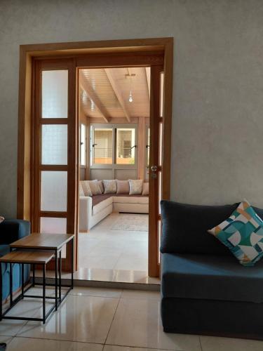a living room with a couch and a table at Tangier Beach Front in Tangier