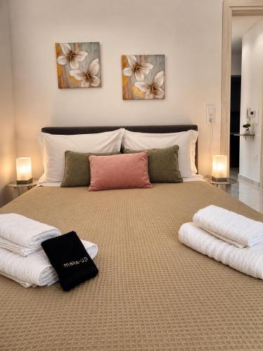 a large bed with two pillows on top of it at Skyloft Meteora 1 in Kalabaka