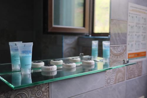 a glass counter with someental products on it at Hotel Marli in Arsha