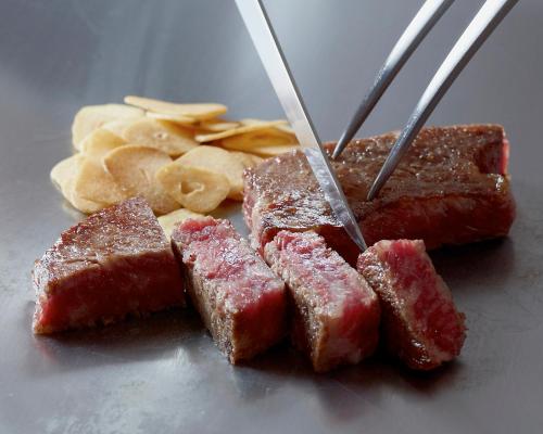a group of meat and chips on a table at Kobe Seishin Oriental Hotel in Kobe