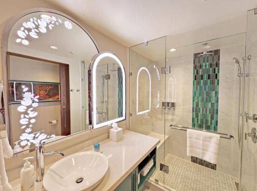 a bathroom with a sink and a shower at Hotel Rosewood Suites Near Delhi IGI Airport in New Delhi